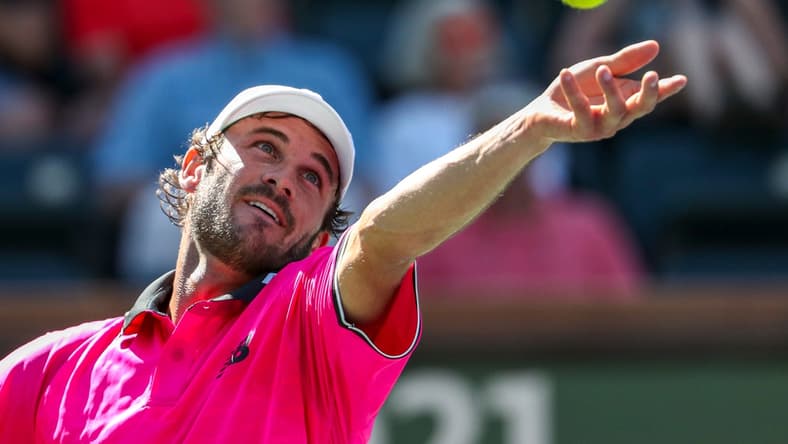 Tommy Paul of the United States serves to Cameron Norrie of Great Britain during their round four match of the BNP Paribas Open, Wednesday, Oct. 13, 2021, in Indian Wells, Calif.