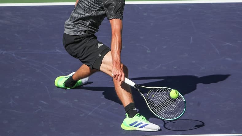 Alexander Zverev reaches for a lob near the net against Taylor Fritz during their quarterfinal match at the BNP Paribas Open in Indian Wells, October 15, 2021.

Bnp Friday 7