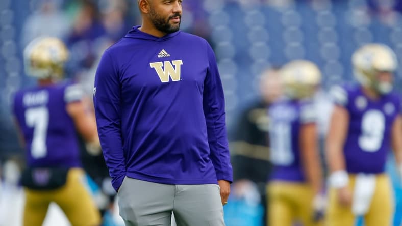 Oct 16, 2021; Seattle, Washington, USA; Washington Huskies head coach Jimmy Lake watches pregame warmups against the UCLA Bruins at Alaska Airlines Field at Husky Stadium. Mandatory Credit: Joe Nicholson-USA TODAY Sports