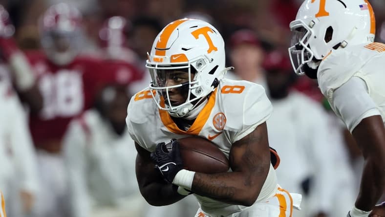 Oct 23, 2021; Tuscaloosa, Alabama, USA; Tennessee Volunteers running back Tiyon Evans (8) carries the ball against the Alabama Crimson Tide during the first half at Bryant-Denny Stadium. Mandatory Credit: Butch Dill-USA TODAY Sports