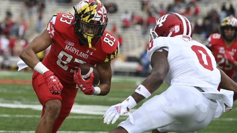 Oct 30, 2021; College Park, Maryland, USA;  Maryland Terrapins wide receiver Carlos Carriere (83) runs after the catch for a touchdown as Indiana Hoosiers quarterback Donaven McCulley (0) defends during the second half at Capital One Field at Maryland Stadium. Mandatory Credit: Tommy Gilligan-USA TODAY Sports