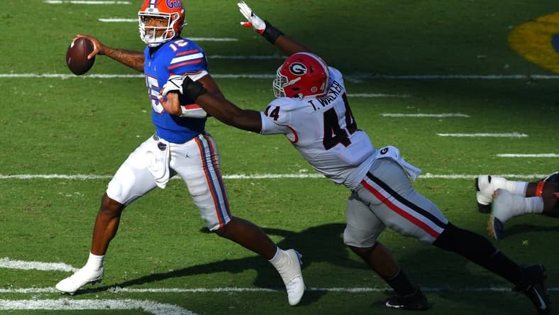 Georgia Bulldogs defensive lineman Travon Walker (44) chases down Florida Gators quarterback Anthony Richardson (15) during second quarter action. The Florida Gators went into the half trailing the Georgia Bulldogs 24 to 0. The Florida Gators were the home team for this years annual Florida vs Georgia college football rivalry game at TIAA Bank field in Jacksonville, Florida Saturday, October 30, 2021. [Bob Self/Florida Times-Union]

Georgia Defense