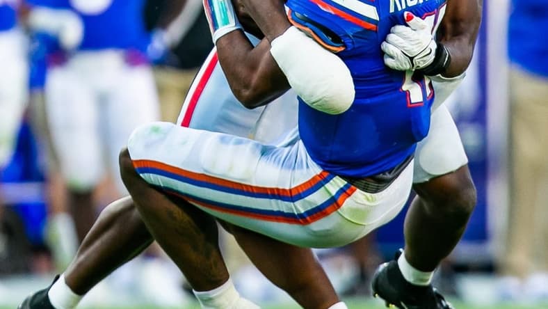 Georgia Bulldogs linebacker Nakobe Dean (17) sacks Florida Gators quarterback Anthony Richardson (15) in the second half. The Florida Gators lost to the Georgia Bulldogs 34-7, Saturday afternoon, October 30, 2021 at TIAA Bank Field in Jacksonville, FL. [Doug Engle/Gainesville Sun]2021

Flgai 103021 Bulldogsvsgators