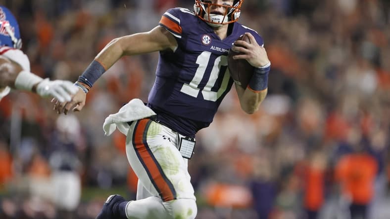 Oct 30, 2021; Auburn, Alabama, USA;  Auburn Tigers quarterback Bo Nix (10) carries the ball for a touchdown against the Mississippi Rebels during the first quarter at Jordan-Hare Stadium.  Mandatory Credit: John Reed-USA TODAY Sports