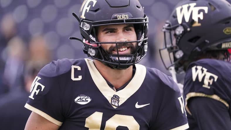 Oct 30, 2021; Winston-Salem, North Carolina, USA;  Wake Forest Demon Deacons quarterback Sam Hartman (10) smiles before the game against the Duke Blue Devils at Truist Field. Mandatory Credit: James Guillory-USA TODAY Sports