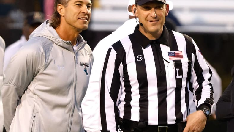 Oct 20, 2021; Boone, North Carolina, USA; Coastal Carolina Chanticleers head coach Jamey Chadwell (left) talks with an official before the game against the Appalachian State Mountaineers at Kidd Brewer Stadium. Mandatory Credit: Reinhold Matay-USA TODAY Sports