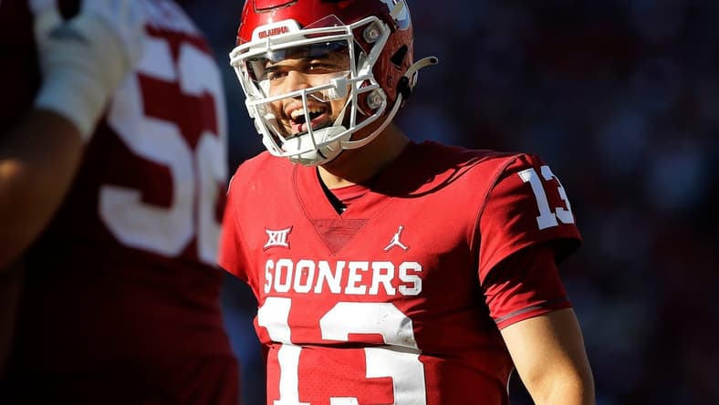 OU quarterback Caleb Williams (13) smiles after throwing a touchdown pass during a 52-21 win against Texas Tech on Saturday at Gaylord Family-Oklahoma Memorial Stadium in Norman.cover main