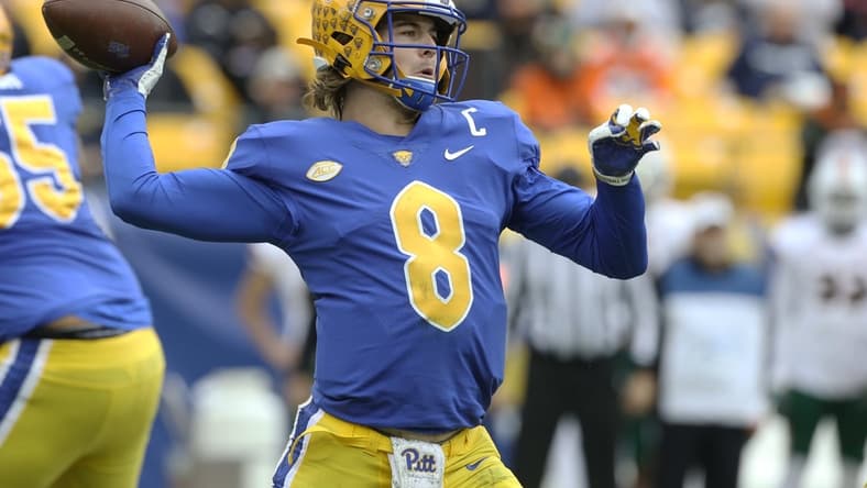 Oct 30, 2021; Pittsburgh, Pennsylvania, USA; Pittsburgh Panthers quarterback Kenny Pickett (8) passes the ball against the Miami Hurricanes during the first quarter at Heinz Field. Mandatory Credit: Charles LeClaire-USA TODAY Sports