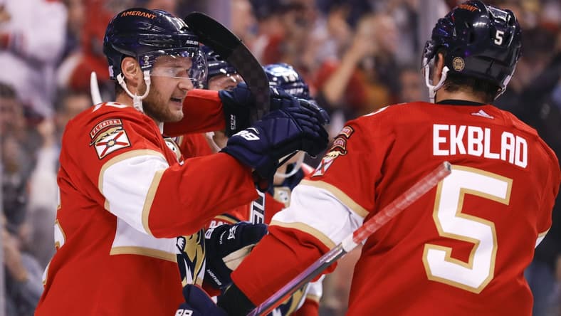 Nov 4, 2021; Sunrise, Florida, USA; Florida Panthers center Aleksander Barkov (16) celebrates with teammates after scoring against the Washington Capitals during the second period of the game at FLA Live Arena. Mandatory Credit: Sam Navarro-USA TODAY Sports