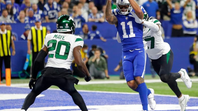 Indianapolis Colts wide receiver Michael Pittman Jr. (11) pulls in a pass in front of New York Jets cornerback Bryce Hall (37) to score a touchdown Thursday, Nov. 4, 2021, during a game against the New York Jets at Lucas Oil Stadium in Indianapolis.