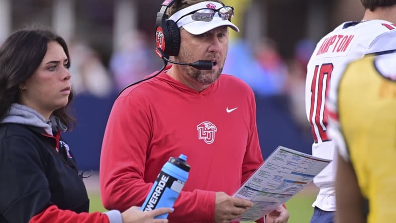 Nov 6, 2021; Oxford, Mississippi, USA; Liberty Flames head coach Hugh Freeze walks down the sideline during the first quarter against the Mississippi Rebels at Vaught-Hemingway Stadium. Mandatory Credit: Matt Bush-USA TODAY Sports