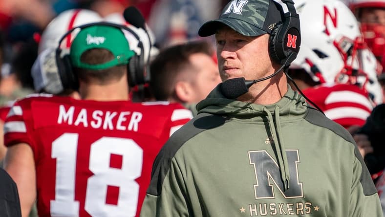 Nov 6, 2021; Lincoln, Nebraska, USA; Nebraska Cornhuskers head coach Scott Frost (right) looks onto the field during the second quarter against the Ohio State Buckeyes at Memorial Stadium. Mandatory Credit: Dylan Widger-USA TODAY Sports