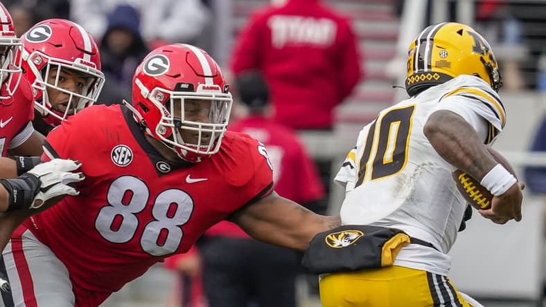 Nov 6, 2021; Athens, Georgia, USA; Georgia Bulldogs defensive lineman Jalen Carter (88) tackles Missouri Tigers quarterback Tyler Macon (10) during the first half at Sanford Stadium. Mandatory Credit: Dale Zanine-USA TODAY Sports