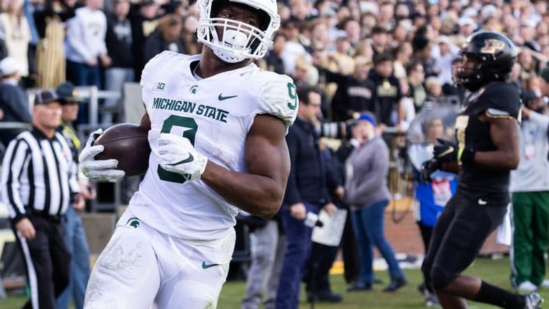 Nov 6, 2021; West Lafayette, Indiana, USA; Michigan State Spartans running back Kenneth Walker III (9) runs for a touchdown in the first half against the Purdue Boilermakers at Ross-Ade Stadium. Mandatory Credit: Trevor Ruszkowski-USA TODAY Sports