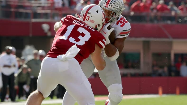 Ohio State Buckeyes running back TreVeyon Henderson (32) is tackled by Nebraska Cornhuskers linebacker JoJo Domann (13) during Saturday's NCAA Division I football game at Memorial Stadium in Lincoln, Neb., on November 6, 2021.

Osu21neb Bjp 531