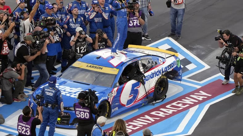 Nov 7, 2021; Avondale, Arizona, USA; NASCAR Cup Series driver Kyle Larson (5) celebrates winning the NASCAR Cup Series Championship at Phoenix Raceway. Mandatory Credit: Mike Dinovo-USA TODAY Sports