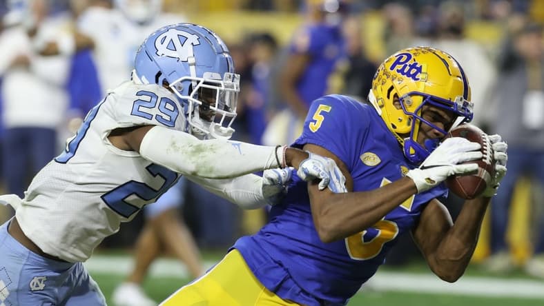 Nov 11, 2021; Pittsburgh, Pennsylvania, USA;  Pittsburgh Panthers wide receiver Jared Wayne (5) catches a thirty-two yard touchdown pass against North Carolina Tar Heels defensive back Storm Duck (29) during the second quarter at Heinz Field. Mandatory Credit: Charles LeClaire-USA TODAY Sports