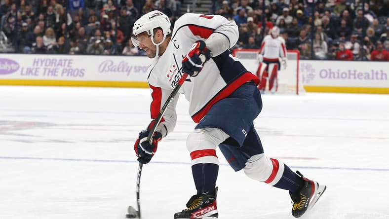 Nov 12, 2021; Columbus, Ohio, USA; Washington Capitals left wing Alex Ovechkin (8) takes a slap shot during the third period against the Columbus Blue Jackets at Nationwide Arena. Mandatory Credit: Russell LaBounty-USA TODAY Sports