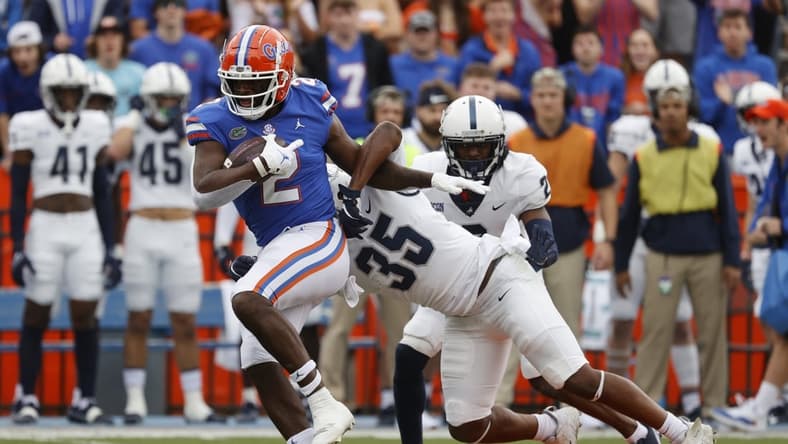 Nov 13, 2021; Gainesville, Florida, USA;Florida Gators tight end Kemore Gamble (2) runs past Samford Bulldogs defensive end Joseph Mera (35) during the first quarter at Ben Hill Griffin Stadium. Mandatory Credit: Kim Klement-USA TODAY Sports