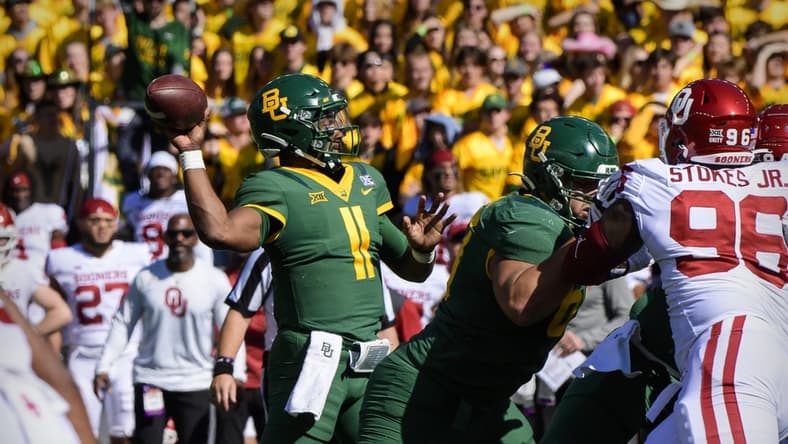 Nov 13, 2021; Waco, Texas, USA; Baylor Bears quarterback Gerry Bohanon (11) passes for a touchdown against the Oklahoma Sooners during the first half at McLane Stadium. Mandatory Credit: Jerome Miron-USA TODAY Sports