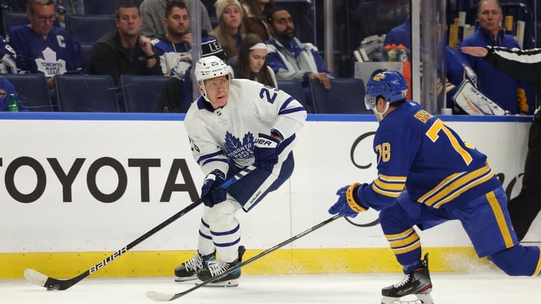 Nov 13, 2021; Buffalo, New York, USA; Toronto Maple Leafs right wing Ondrej Kase (25) looks to make a pass as Buffalo Sabres defenseman Jacob Bryson (78) defends during the first period at KeyBank Center. Mandatory Credit: Timothy T. Ludwig-USA TODAY Sports