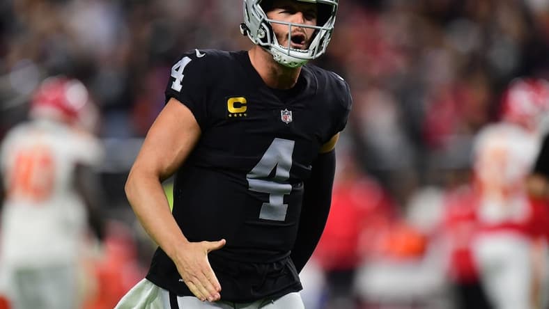 Nov 14, 2021; Paradise, Nevada, USA; Las Vegas Raiders quarterback Derek Carr (4) celebrates the touchdown scored by wide receiver Bryan Edwards (89) during the second half at Allegiant Stadium. Mandatory Credit: Gary A. Vasquez-USA TODAY Sports
