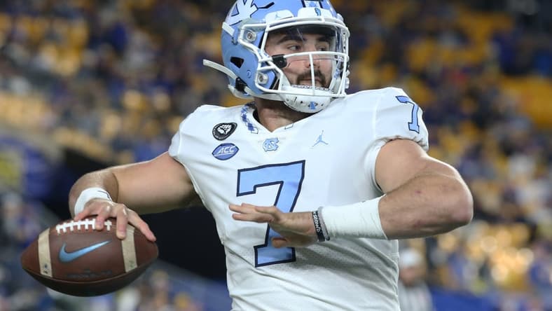 Nov 11, 2021; Pittsburgh, Pennsylvania, USA; North Carolina Tar Heels quarterback Sam Howell (7) warms up on the sidelines against the Pittsburgh Panthers during the first quarter at Heinz Field. Mandatory Credit: Charles LeClaire-USA TODAY Sports