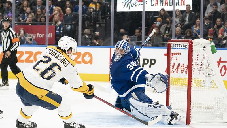 Nov 16, 2021; Toronto, Ontario, CAN; Nashville Predators center Philip Tomasino (26) charges the net on Toronto Maple Leafs goaltender Jack Campbell (36) during the first period at Scotiabank Arena. Mandatory Credit: Nick Turchiaro-USA TODAY Sports