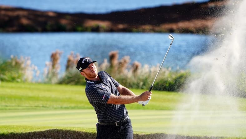 Nov 19, 2021; Sea Island, Georgia, USA; Talor Gooch plays a shot from a bunker on the 17th hole during the second round of the RSM Classic golf tournament at Sea Island Golf Club - Plantation Course. Mandatory Credit: John David Mercer-USA TODAY Sports