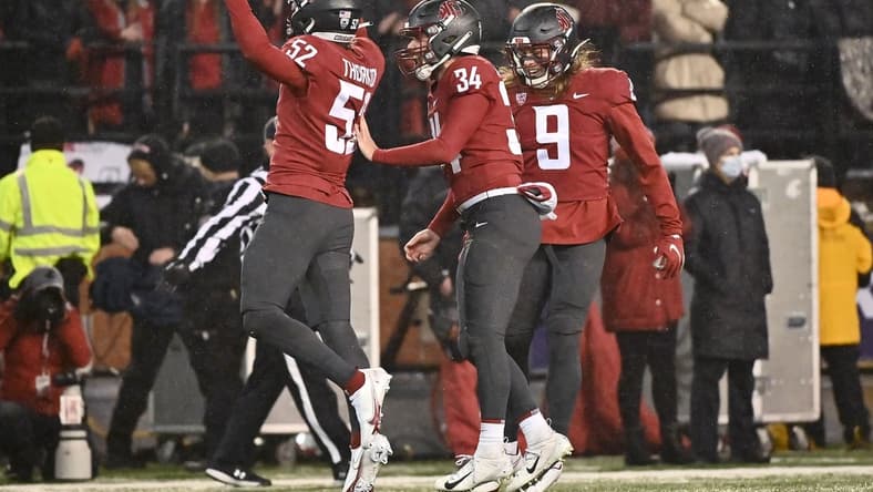 Nov 19, 2021; Pullman, Washington, USA; Washington State Cougars linebacker Kyle Thornton (52) celebrates against the Arizona Wildcats in the first half at Gesa Field at Martin Stadium. Mandatory Credit: James Snook-USA TODAY Sports