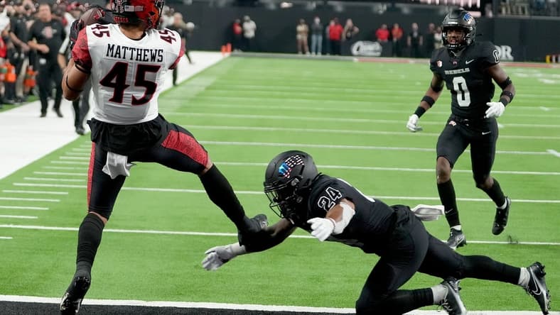Nov 19, 2021; Paradise, Nevada, USA; San Diego State Aztecs wide receiver Jesse Matthews (45) makes a touchdown reception against UNLV Rebels defensive back Bryce Jackson (24) at Allegiant Stadium. Mandatory Credit: Stephen R. Sylvanie-USA TODAY Sports