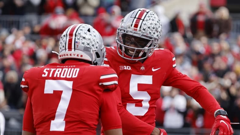 Nov 20, 2021; Columbus, Ohio, USA;  Ohio State Buckeyes wide receiver Garrett Wilson (5) celebrates his touch down with quarterback C.J. Stroud (7) in the first half against the Michigan State Spartans at Ohio Stadium. Mandatory Credit: Rick Osentoski-USA TODAY Sports