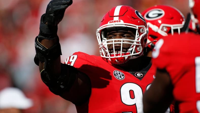 Georgia defensive lineman Jordan Davis (99) celebrates after getting his first career touchdown during the first half of a NCAA college football game between Charleston Southern and Georgia in Athens, Ga., on Saturday, Nov. 20, 2021. Georgia won 56-7.

News Joshua L Jones