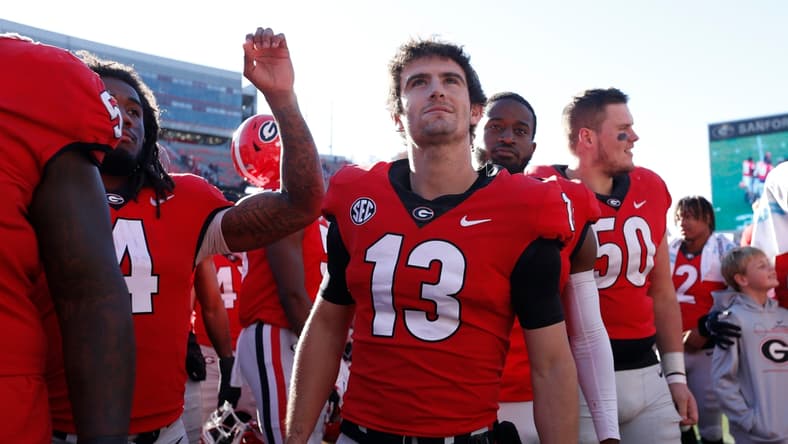 Georgia quarterback Stetson Bennett (13) looks up at fans after a NCAA college football game between Charleston Southern and Georgia in Athens, Ga., on Saturday, Nov. 20, 2021. Georgia won 56-7.

News Joshua L Jones