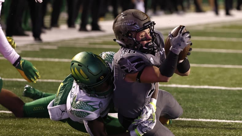 Nov 20, 2021; Salt Lake City, Utah, USA; Utah Utes wide receiver Britain Covey (18) is taken down at the one-yard line in the second quarter against the Oregon Ducks at Rice-Eccles Stadium. Mandatory Credit: Jeffrey Swinger-USA TODAY Sports