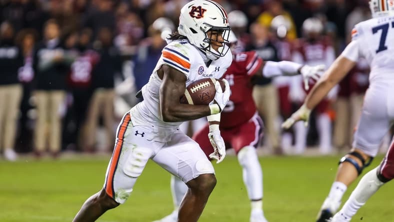 Nov 20, 2021; Columbia, South Carolina, USA; Auburn Tigers running back Tank Bigsby (4) rushes against the South Carolina Gamecocks in the third quarter at Williams-Brice Stadium. Mandatory Credit: Jeff Blake-USA TODAY Sports