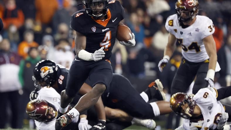 Nov 20, 2021; Corvallis, Oregon, USA; Oregon State Beavers running back B.J. Baylor (4) runs with the ball against the Arizona State Sun Devils during the second half at Reser Stadium. Mandatory Credit: Soobum Im-USA TODAY Sports