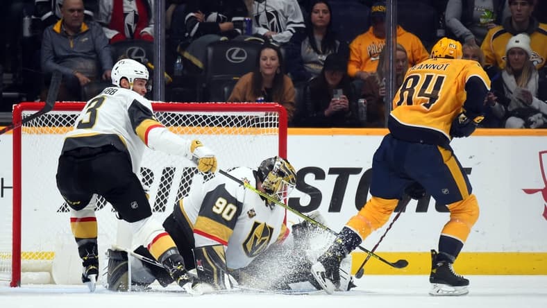 Nov 24, 2021; Nashville, Tennessee, USA; Vegas Golden Knights goalie Robin Lehner (90) makes a save on a shot attempt from Nashville Predators left wing Tanner Jeannot (84) during the second period at Bridgestone Arena. Mandatory Credit: Christopher Hanewinckel-USA TODAY Sports