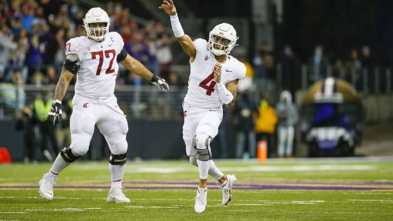 Nov 26, 2021; Seattle, Washington, USA; Washington State Cougars quarterback Jayden de Laura (4) passes against the Washington Huskies during the second quarter at Alaska Airlines Field at Husky Stadium. Mandatory Credit: Joe Nicholson-USA TODAY Sports