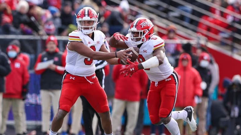 Nov 27, 2021; Piscataway, New Jersey, USA; Maryland Terrapins quarterback Taulia Tagovailoa (3) hands off to running back Tayon Fleet-Davis (8) against the Rutgers Scarlet Knights during the first half at SHI Stadium. Mandatory Credit: Vincent Carchietta-USA TODAY Sports