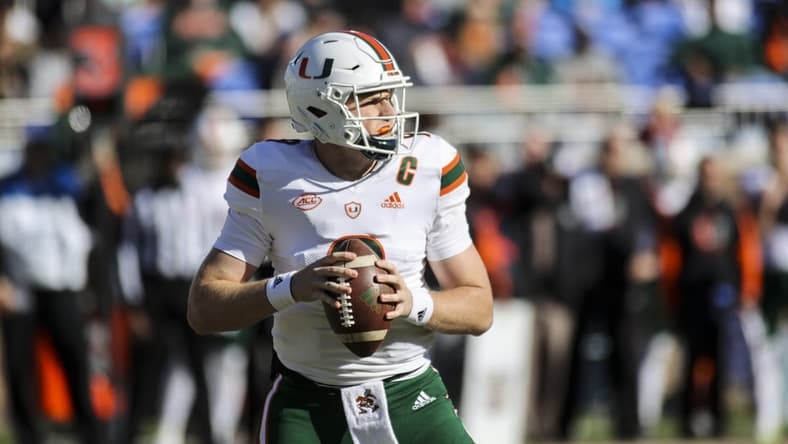 Nov 27, 2021; Durham, North Carolina, USA; Miami Hurricanes quarterback Tyler Van Dyke (9) with the ball during the first half of the game against the Miami Hurricanes at Wallace Wade Stadium. at Wallace Wade Stadium. Mandatory Credit: Jaylynn Nash-USA TODAY Sports