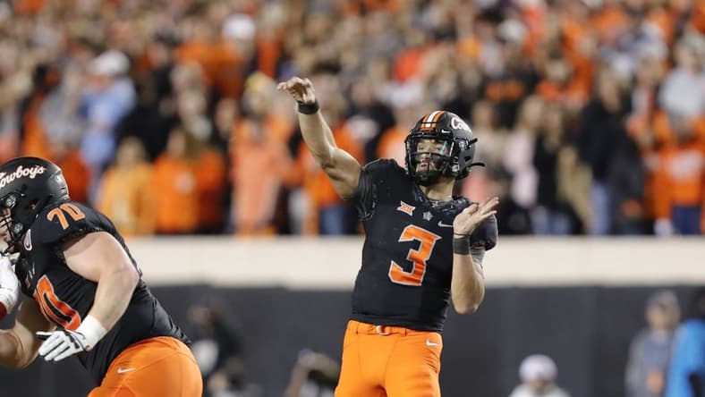 Nov 27, 2021; Stillwater, Oklahoma, USA; Oklahoma State Cowboys quarterback Spencer Sanders (3) passes the ball against the Oklahoma Sooners during the first half at Boone Pickens Stadium. Mandatory Credit: Alonzo Adams-USA TODAY Sports