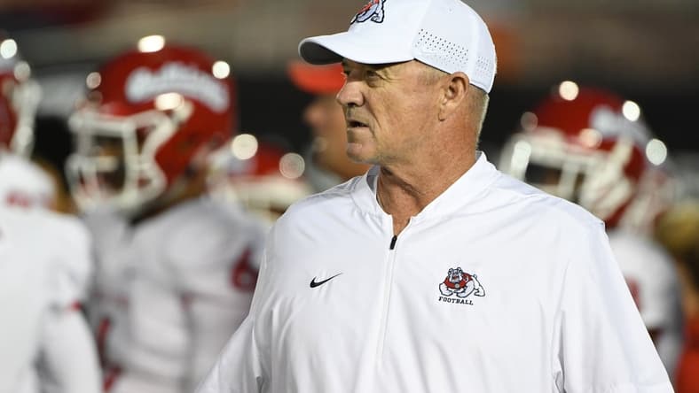 Sep 15, 2018; Pasadena, CA, USA; Fresno State Bulldogs head coach Jeff Tedford watches his team run pregame drills during warmups before a game against the UCLA Bruins at the Rose Bowl. Mandatory Credit: Robert Hanashiro-USA TODAY Sports