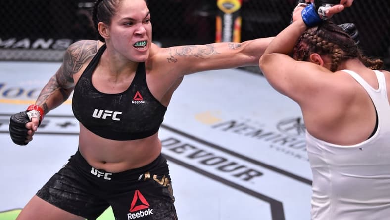 June 6, 2020; Las Vegas, NV, USA; Amanda Nunes of Brazil punches Felicia Spencer of Canada in their UFC featherweight championship bout  during UFC 250 at the UFC APEX.  Mandatory Credit: Jeff Bottari/Zuffa LLC via USA TODAY Sports