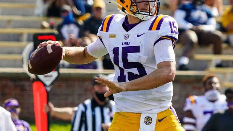 Oct 10, 2020; Columbia, Missouri, USA; LSU Tigers quarterback Myles Brennan (15) throws a pass against the Missouri Tigers during the first half at Faurot Field at Memorial Stadium. Mandatory Credit: Jay Biggerstaff-USA TODAY Sports
