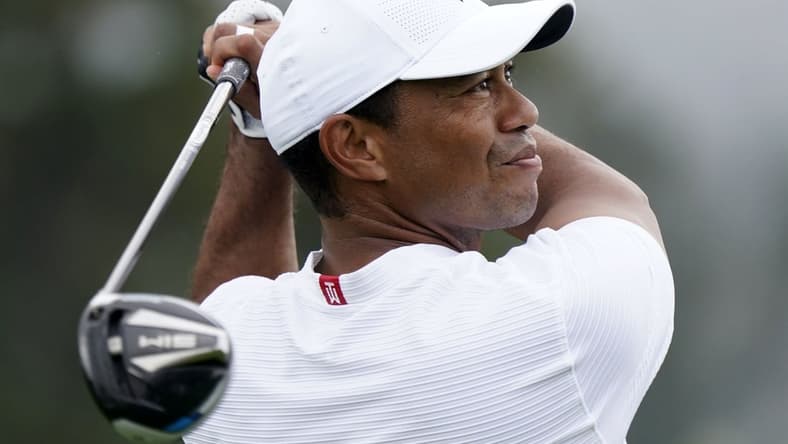 Nov 11, 2020; Augusta, Georgia, USA; Tiger Woods plays his tee shot on the first hole during a practice round for The Masters golf tournament at Augusta National GC. Mandatory Credit: Rob Schumacher-USA TODAY Sports