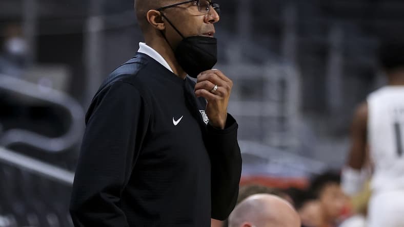 Feb 14, 2021; Cincinnati, Ohio, USA; UCF Knights head coach Johnny Dawkins works the sideline against the Cincinnati Bearcats in the first half at Fifth Third Arena. Mandatory Credit: Aaron Doster-USA TODAY Sports