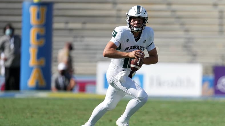 Aug 28, 2021; Pasadena, California, USA; Hawaii Rainbow Warriors  quarterback Brayden Schager (13) drops back to pass in the fourth quarter against the UCLA Bruinsat Rose Bowl. Mandatory Credit: Kirby Lee-USA TODAY Sports