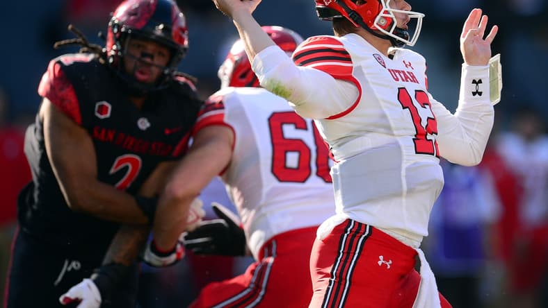 Sep 18, 2021; Carson, California, USA; Utah Utes quarterback Charlie Brewer (12) throws against the San Diego State Aztecs during the first half at Dignity Health Sports Park. Mandatory Credit: Gary A. Vasquez-USA TODAY Sports