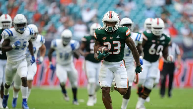 Sep 25, 2021; Miami Gardens, Florida, USA; Miami Hurricanes running back Cam'Ron Harris (23) runs the ball for a touchdown during the first half against the Central Connecticut State Blue Devils at Hard Rock Stadium. Mandatory Credit: Jasen Vinlove-USA TODAY Sports